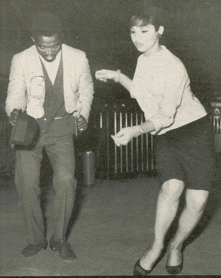 A vintage monochrome photograph of two people dancing.