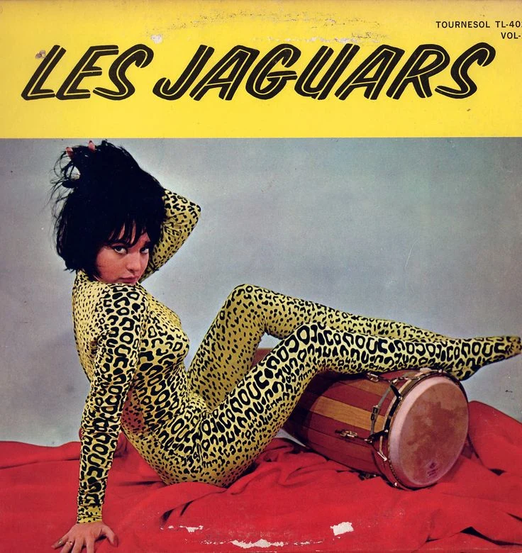 A vintage record sleeve with a reclining figure in a spotted outfit.